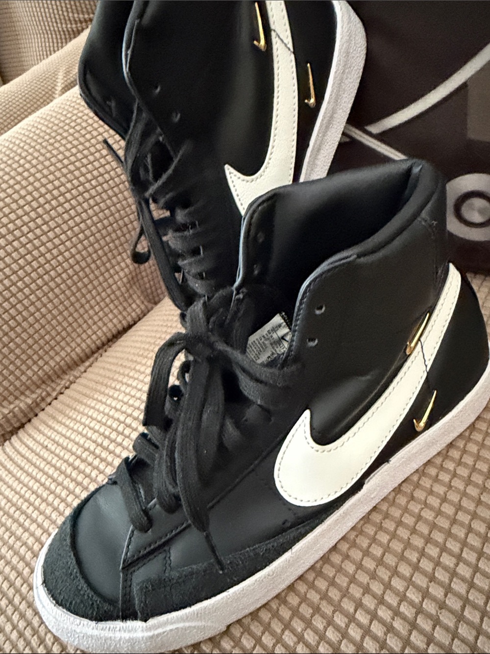Nike Black & White High-Top Sneakers with Gold Swoosh